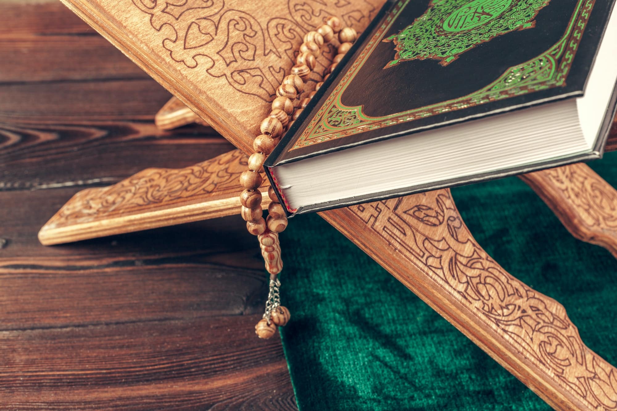 islamic holy book on wooden table