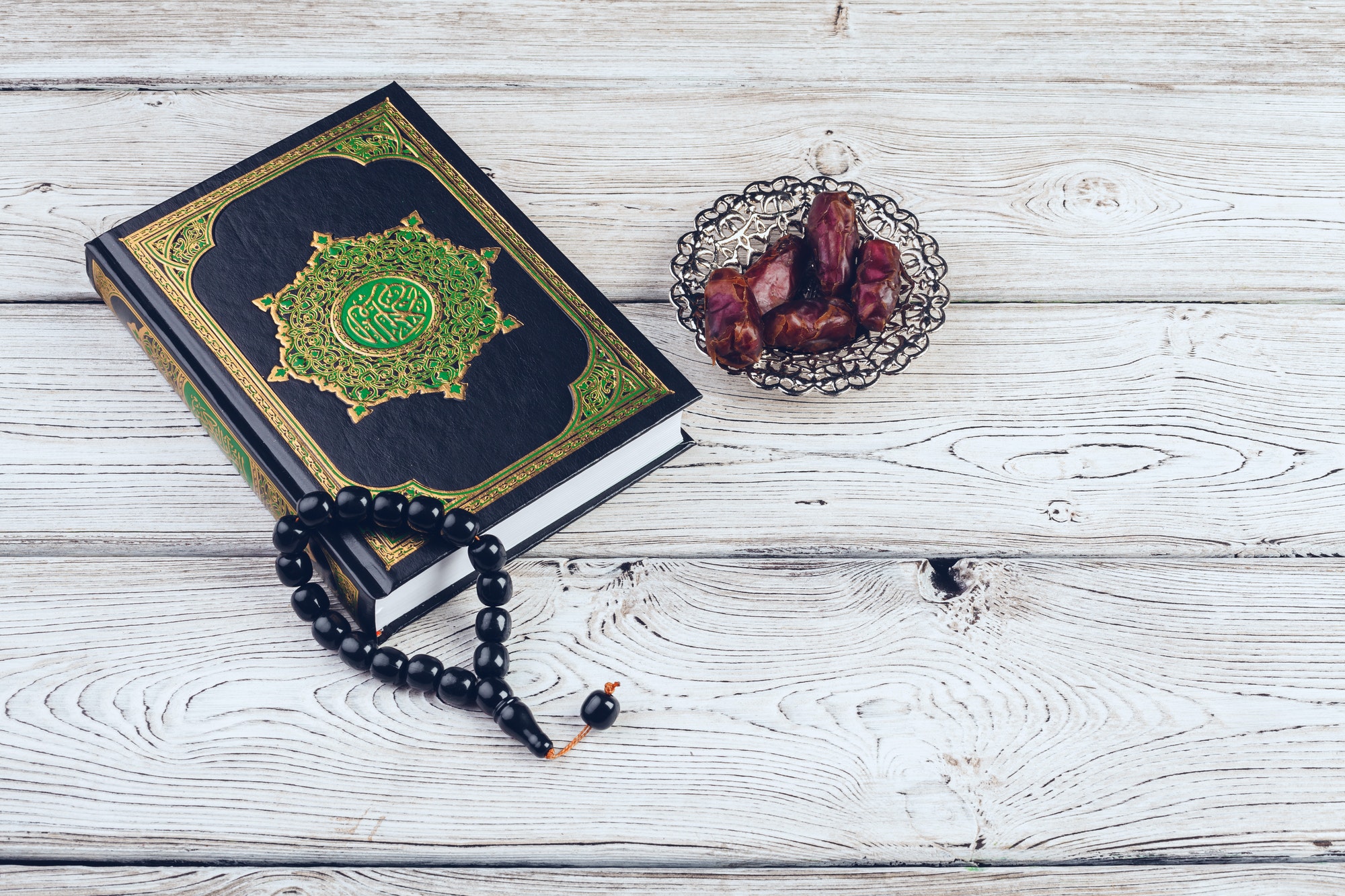 islamic holy book on wooden table