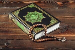 islamic holy book on wooden table