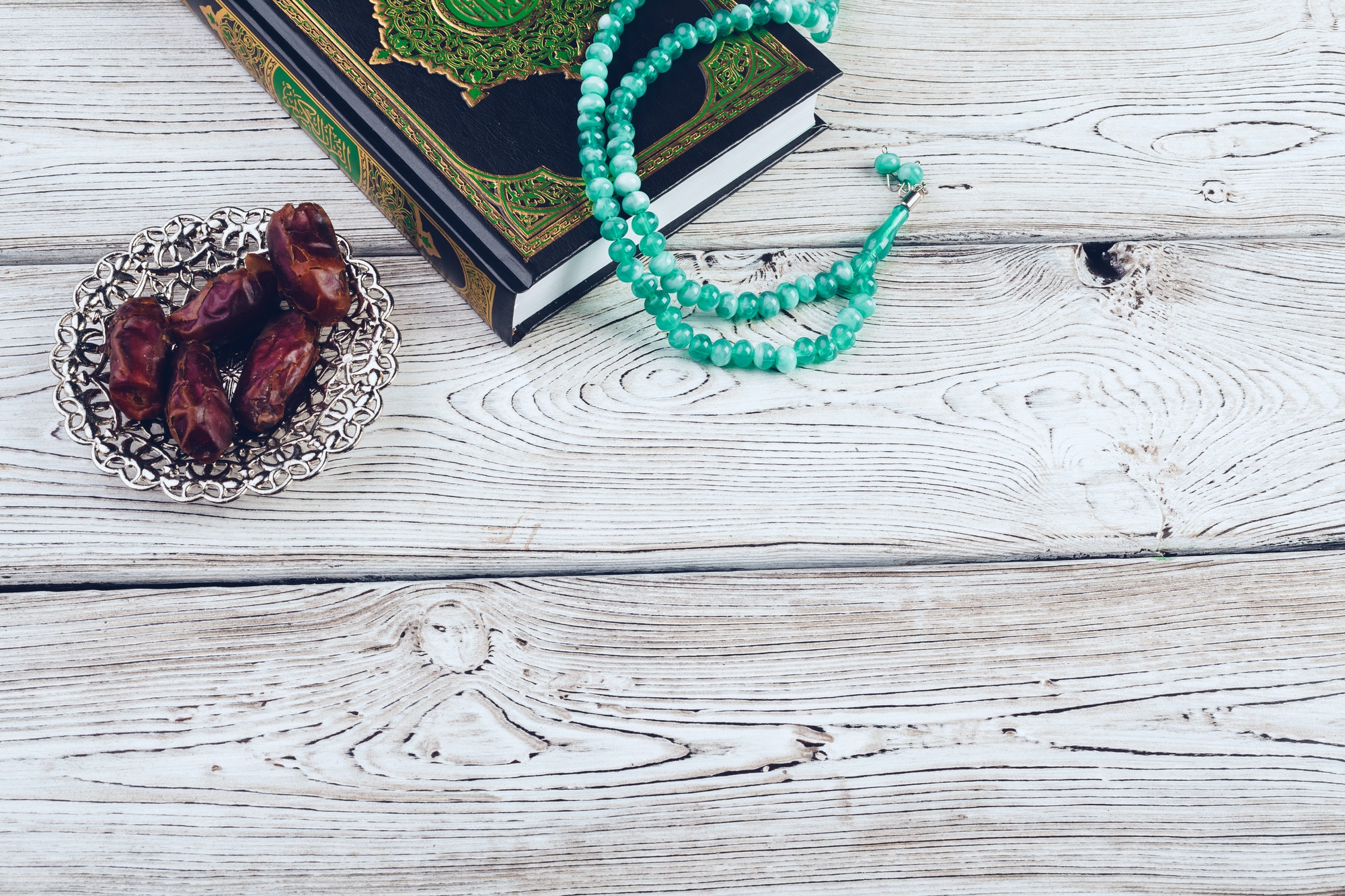 islamic holy book on wooden table